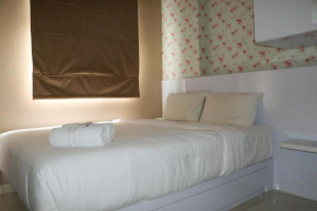 Homey and Cozy Stay 2BR at Green Pramuka City Apartment By Travelio
